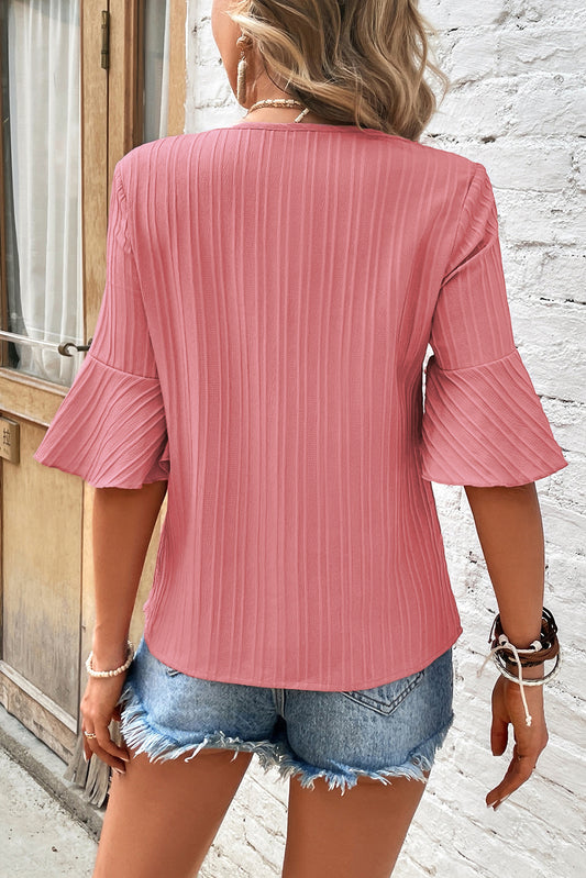 Textured top with V-neck, half-ruffle sleeves and peach blossom ruffles